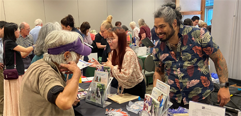 Attendee talking with a vendor